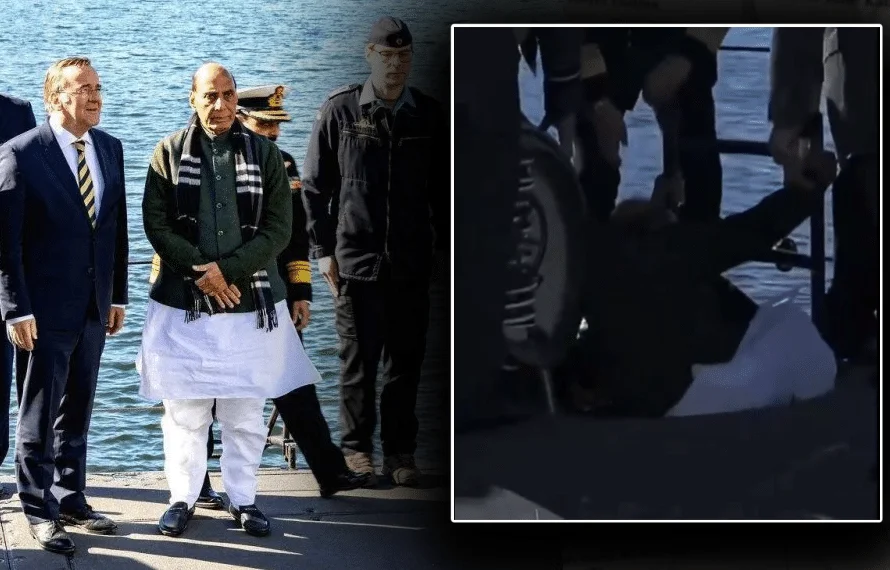 Indian Defense Minister Rajnath Singh tarped in narrow entrance of German submarine