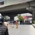 Why did Peshawar Police use baton-charge against peace march participants?